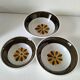 Set of three Italian deep plates from the 1970s, with ochre brown floral decoration.