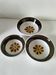 Set of three Italian deep plates from the 1970s, with ochre brown floral decoration.