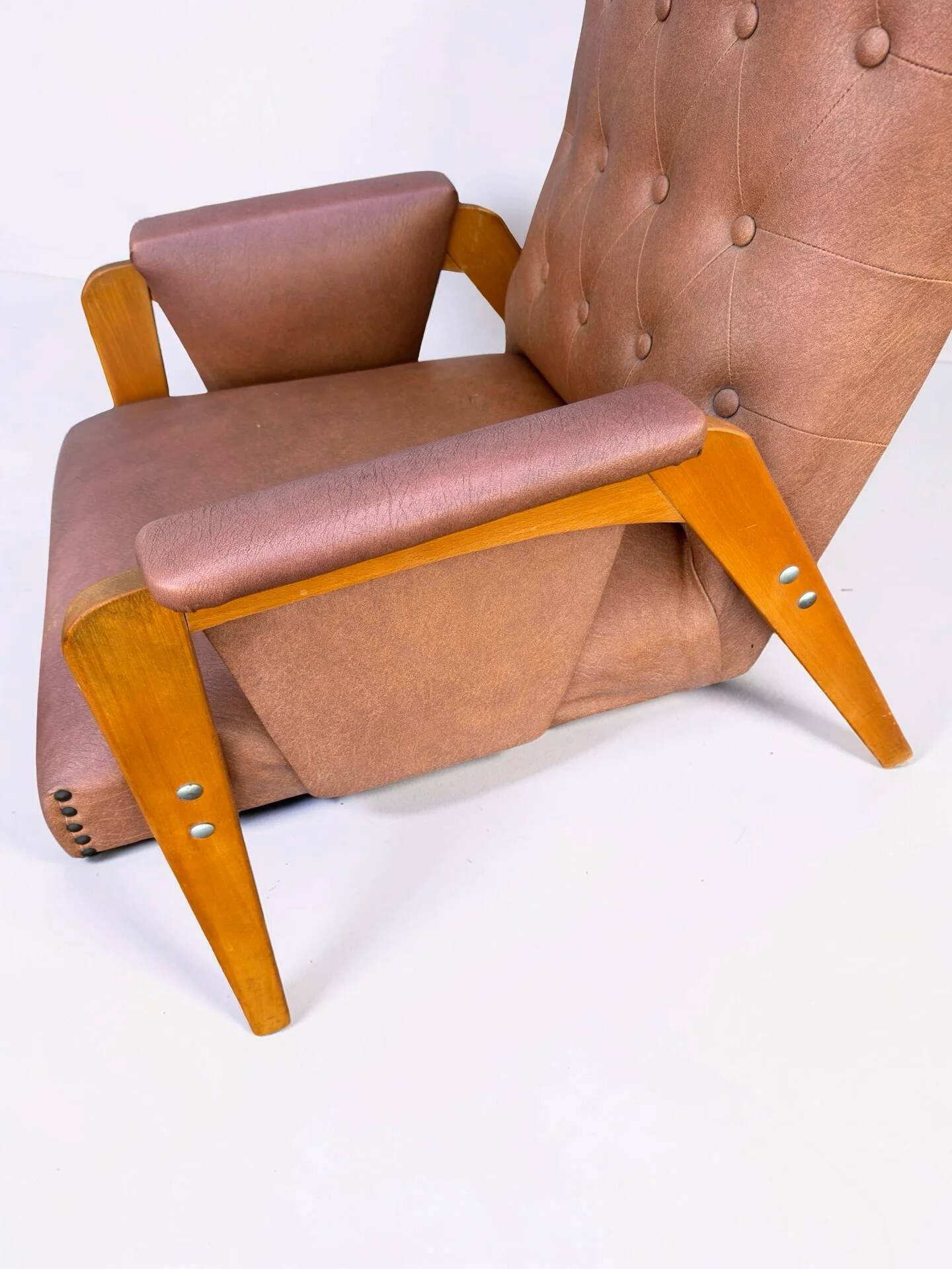 Vintage armchair in light brown faux leather, 1960s.