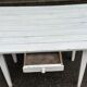 Vintage white wooden kitchen table with drawer from the 19th century.