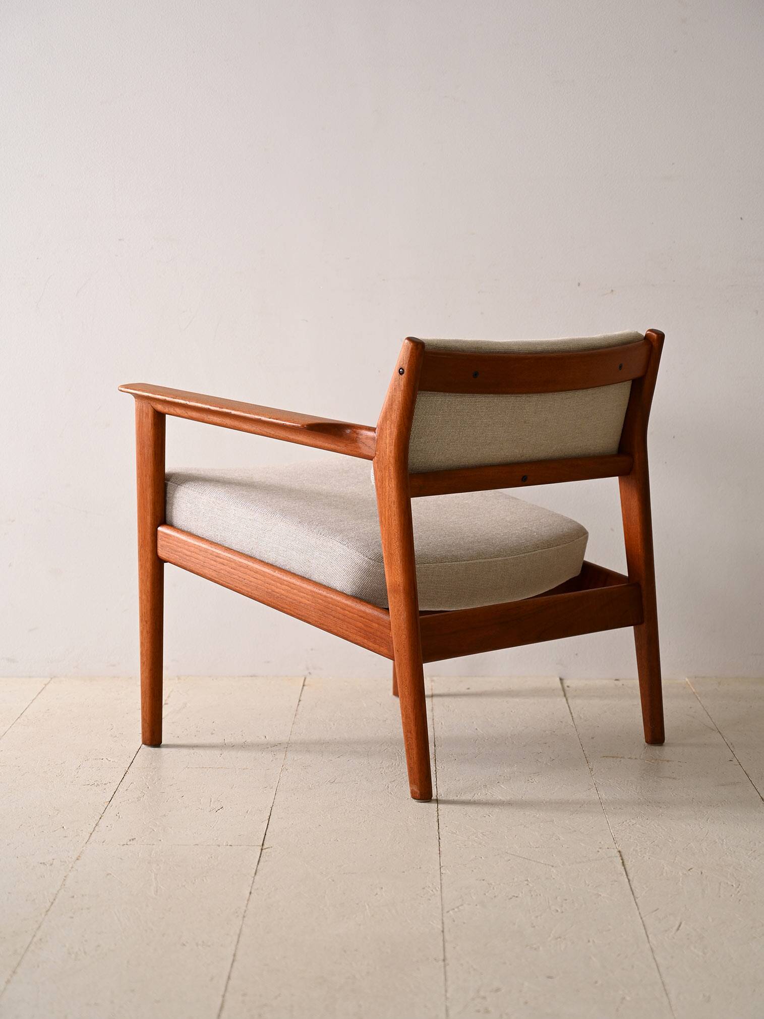 Upholstered armchair with teak frame