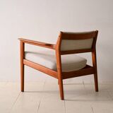 Upholstered armchair with teak frame