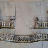 Louis XVI style bronze andirons and fireplace bar