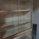 Ivory-colored and matte gold anodized aluminum display bookcase