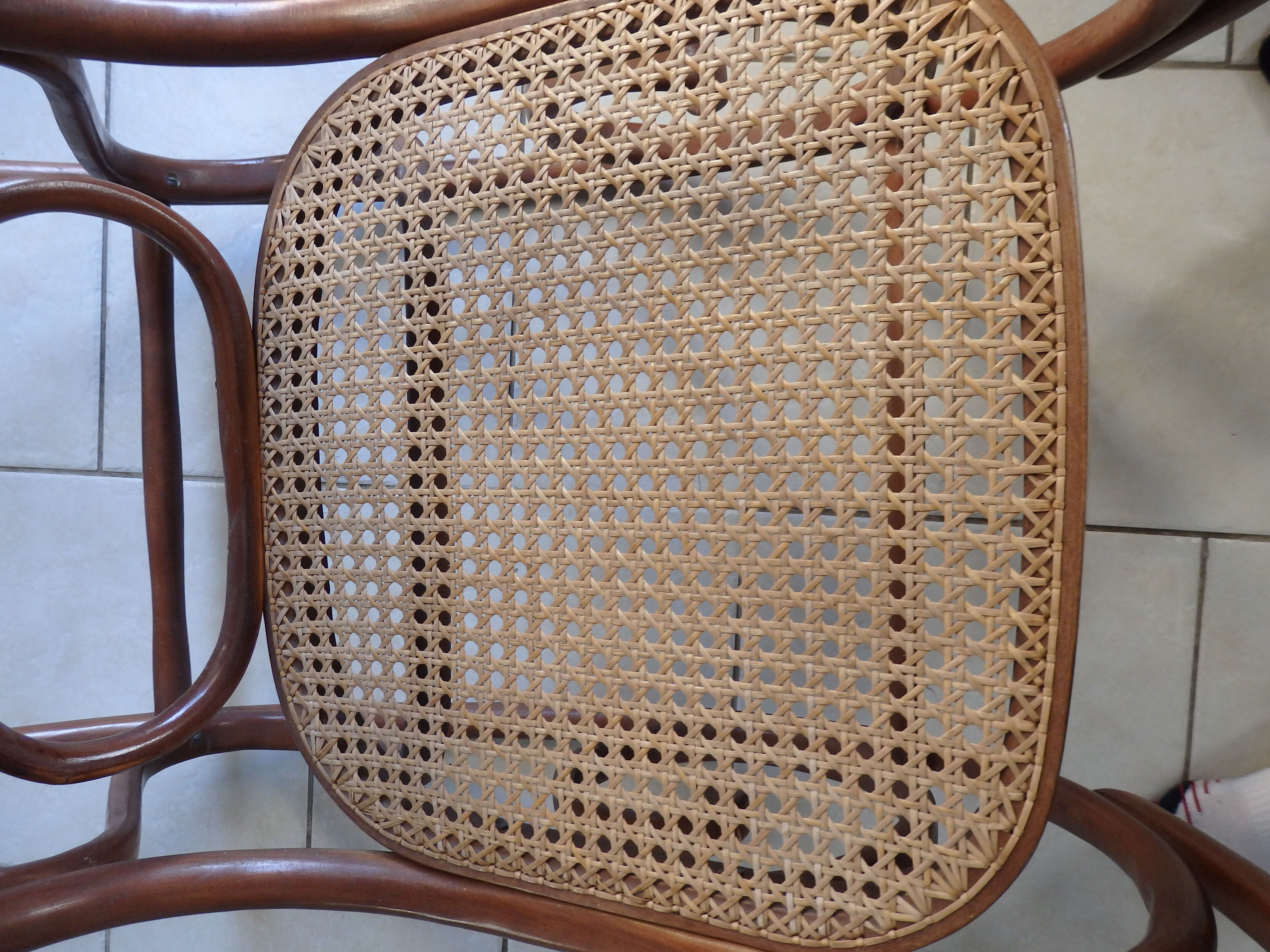 Rocking-chair in turned wood and cannage