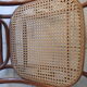 Rocking-chair in turned wood and cannage