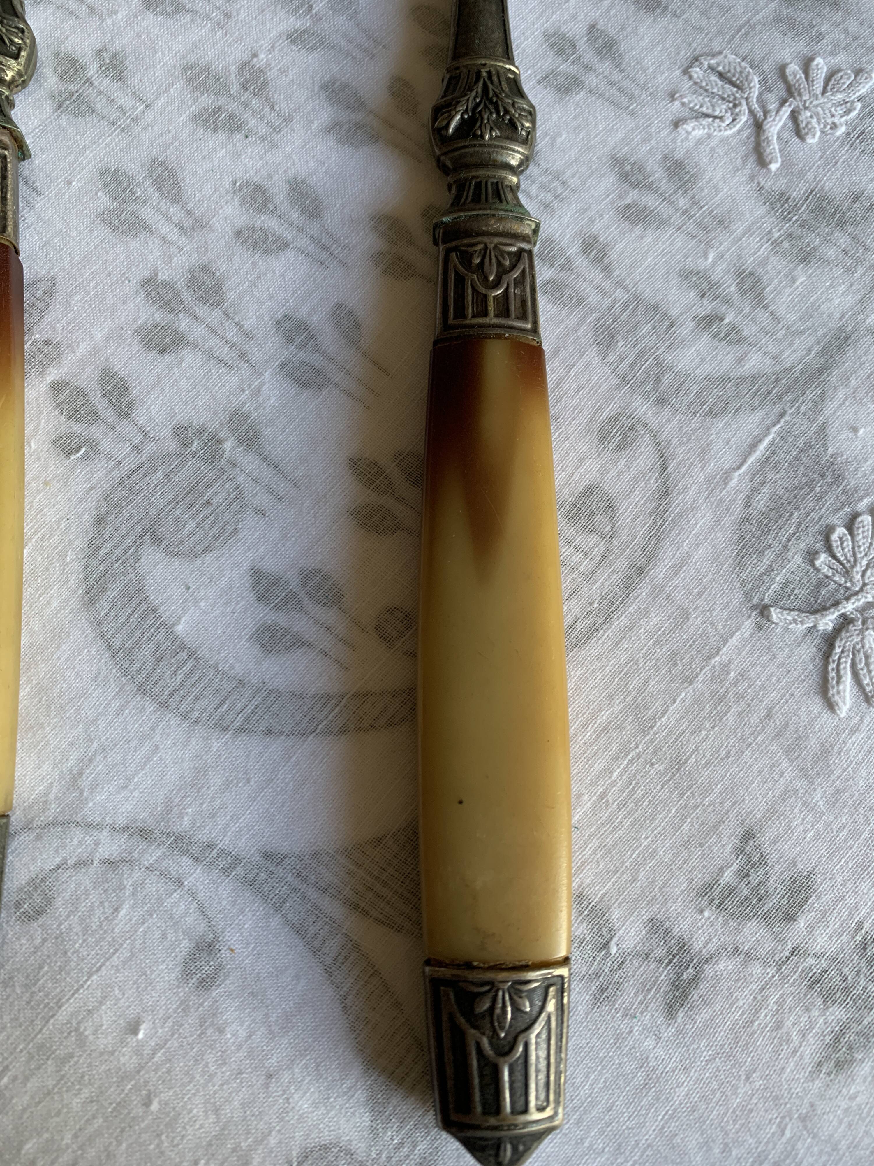 Horn and metal salad servers from the 1920s