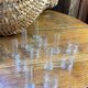 Knife rests, flower vases and candle holders in blown glass.