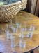 Knife rests, flower vases and candle holders in blown glass.