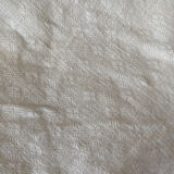 Old white cotton tablecloth.