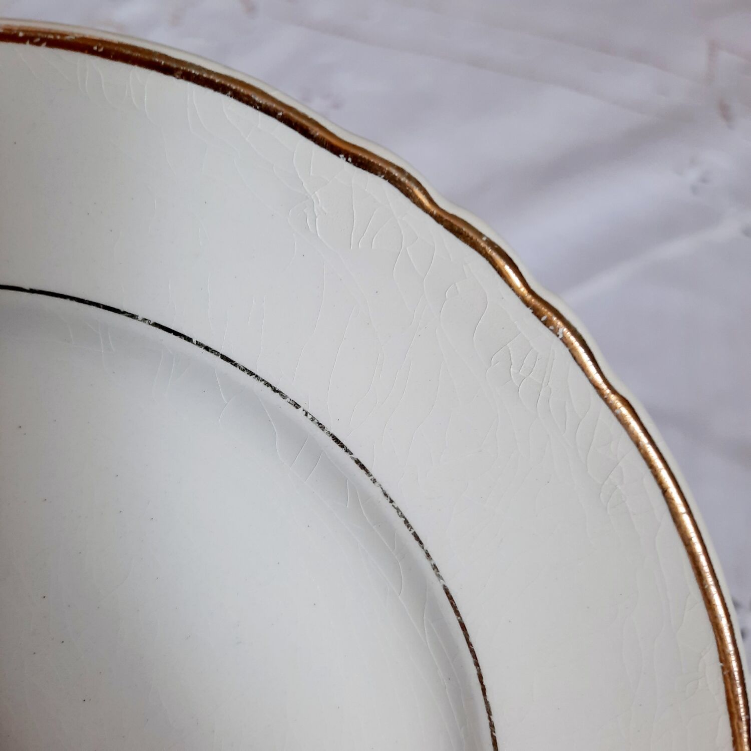 Antique dessert plates mismatched in earthenware with gilded edges