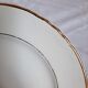Antique dessert plates mismatched in earthenware with gilded edges