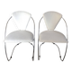 Set of two design chairs in steel and faux leather.