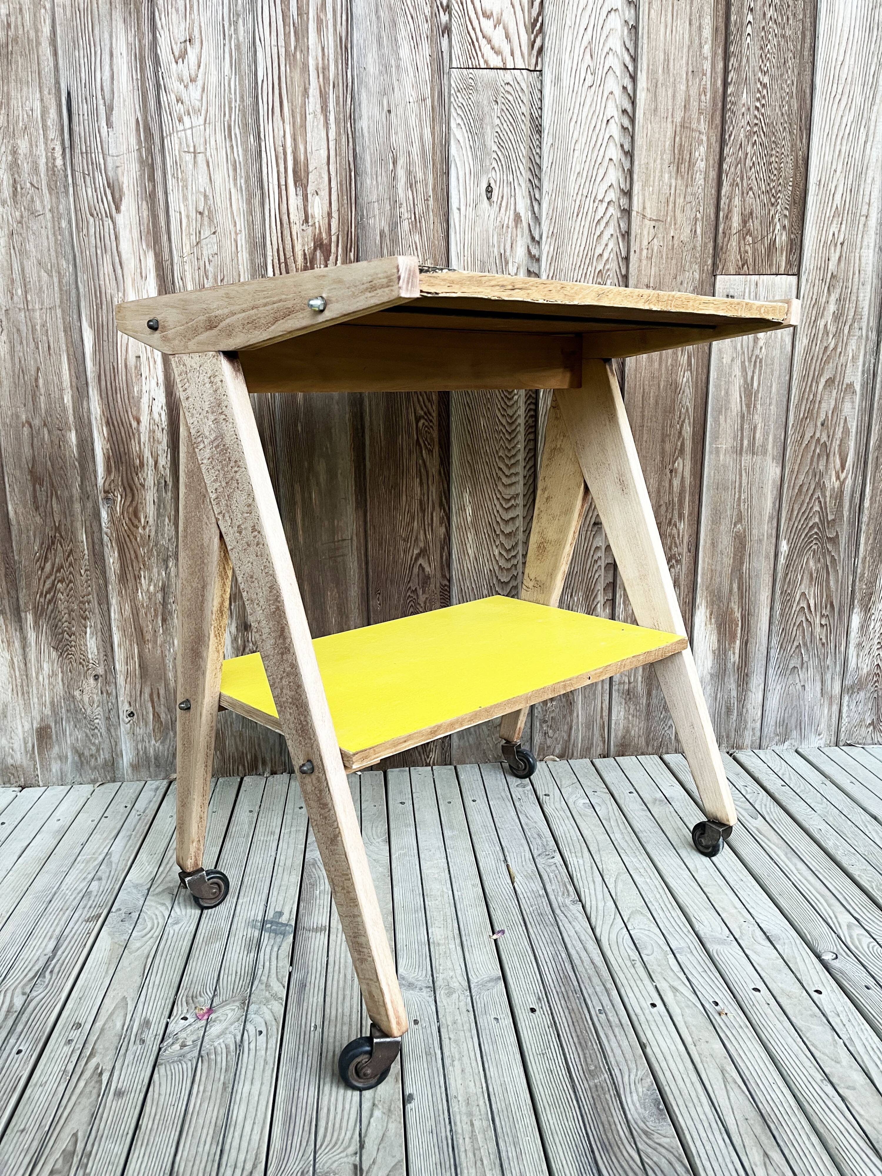 Yellow and blue serving trolley with compass base, 1950s
