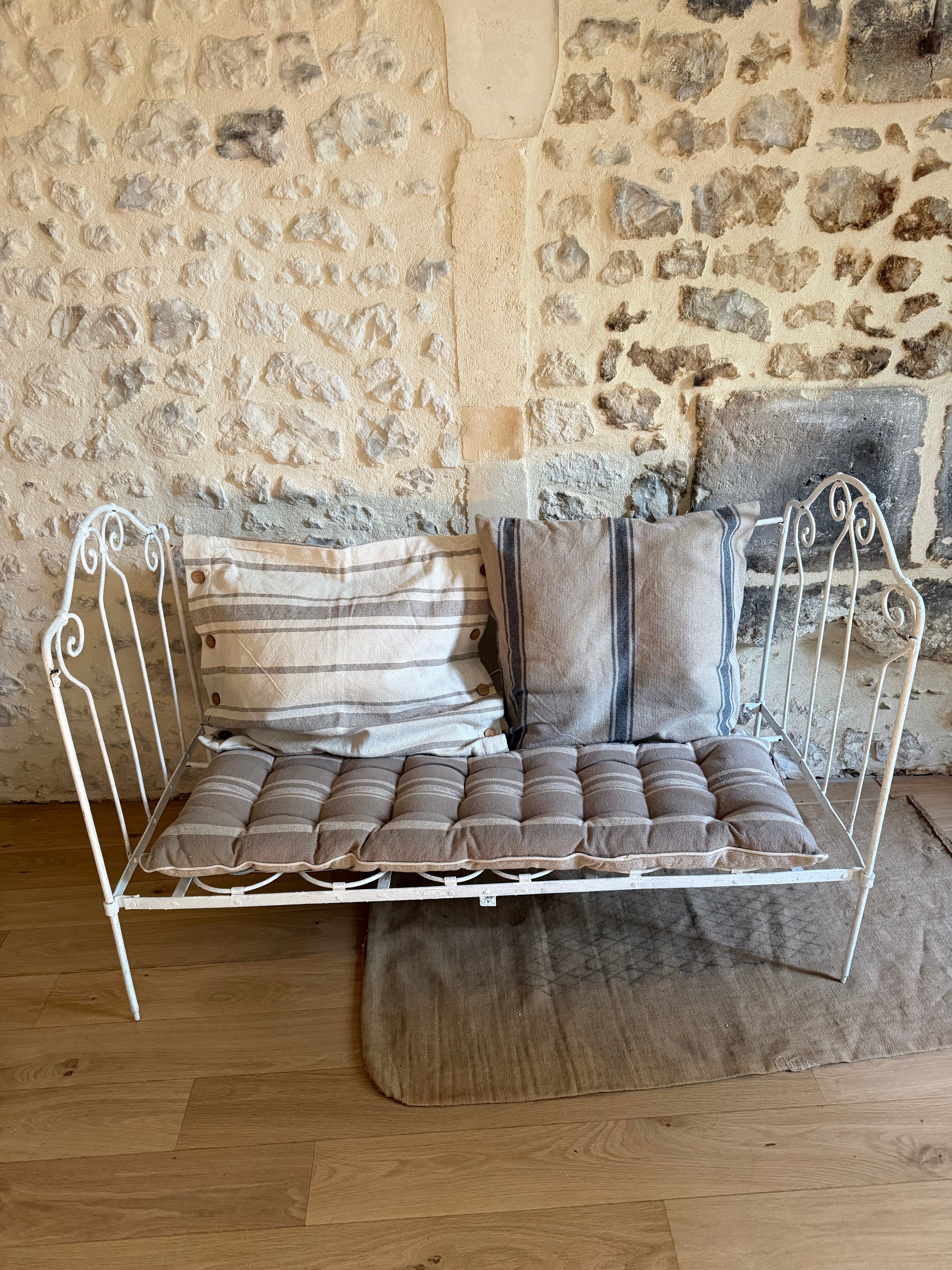 Small renovated wrought iron bed