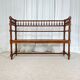 Antique banquette in Louis XIII style, turned wood with caning, late 19th to early 20th century.