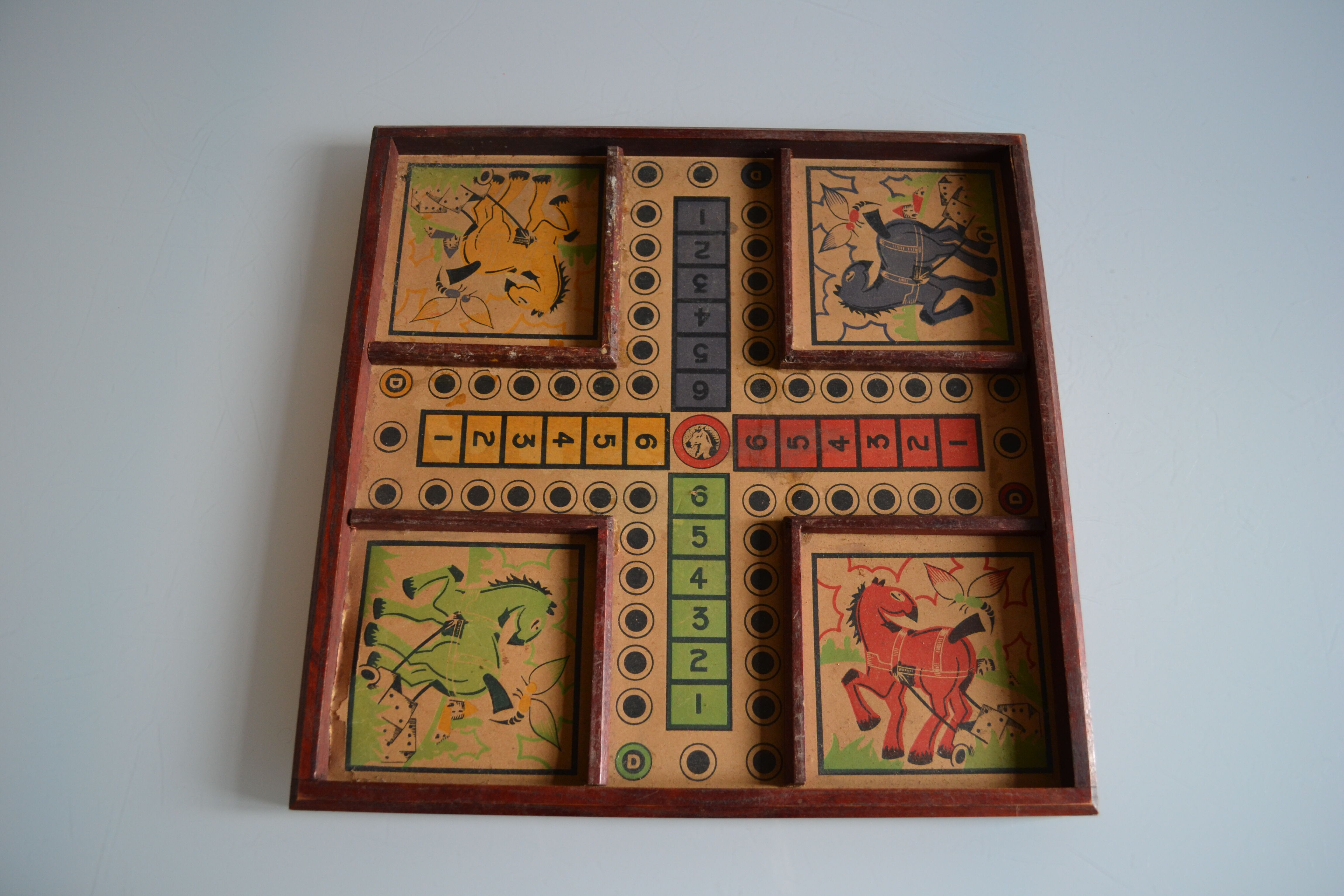 Old game board of small horses
