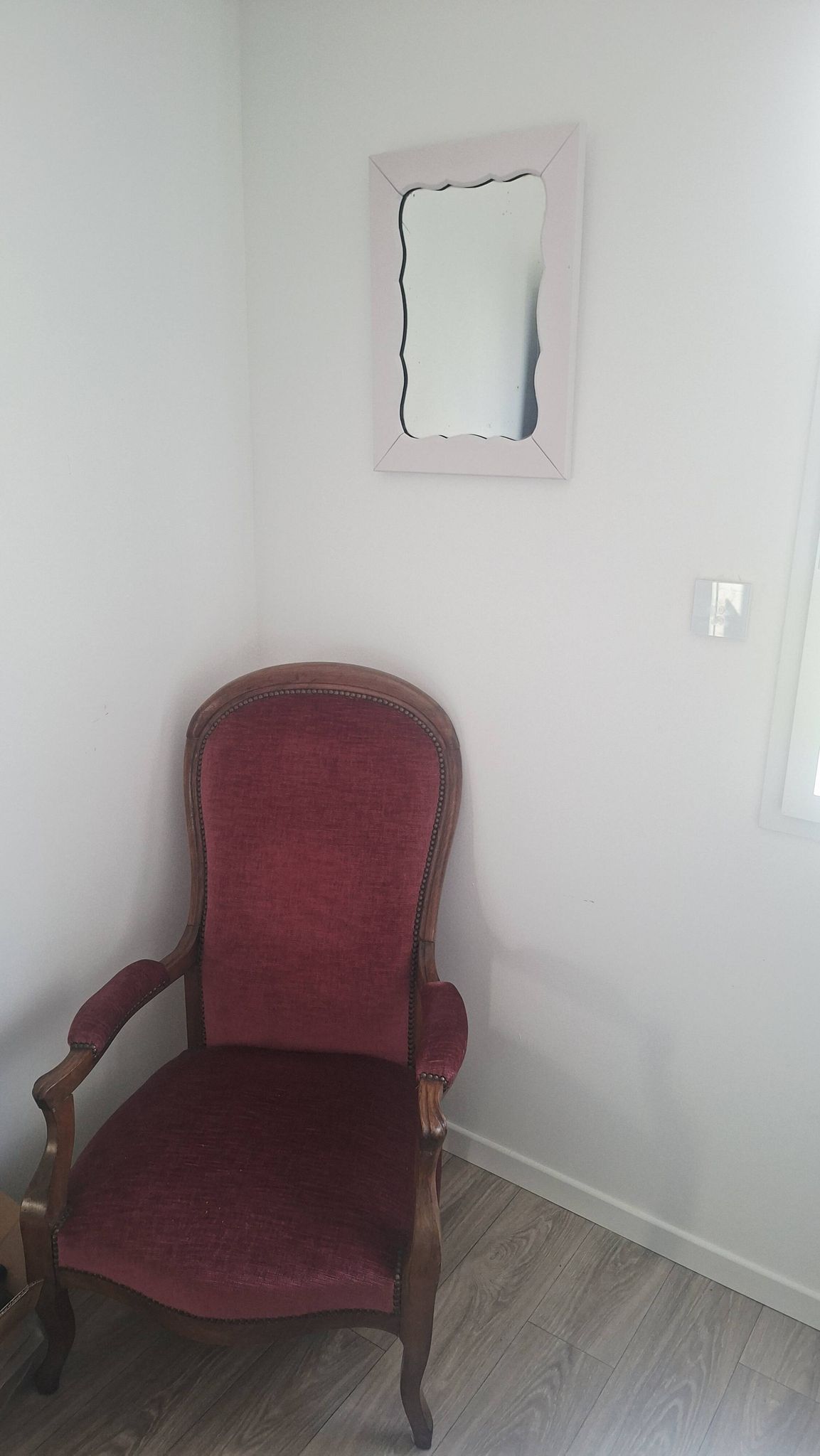 Mid-20th century rectangular wall mirror with a powder pink frame.
