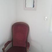 Mid-20th century rectangular wall mirror with a powder pink frame.
