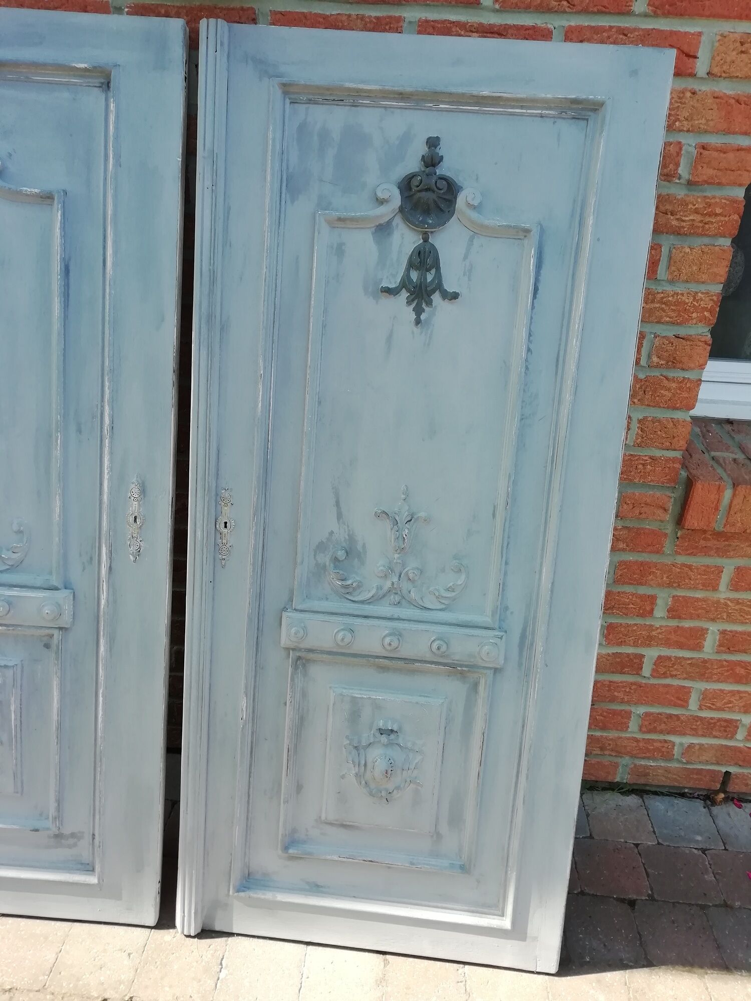 Pair of old door painted in carved wood