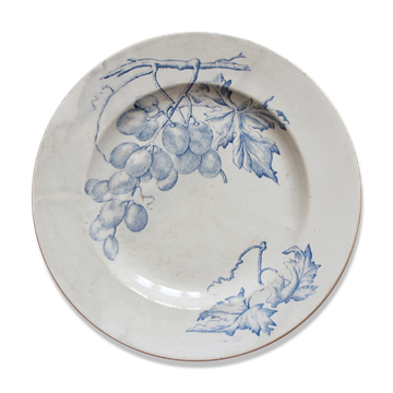 Plat rond en terre de fer décor de vignes et raisins, fin XIXe début XXe