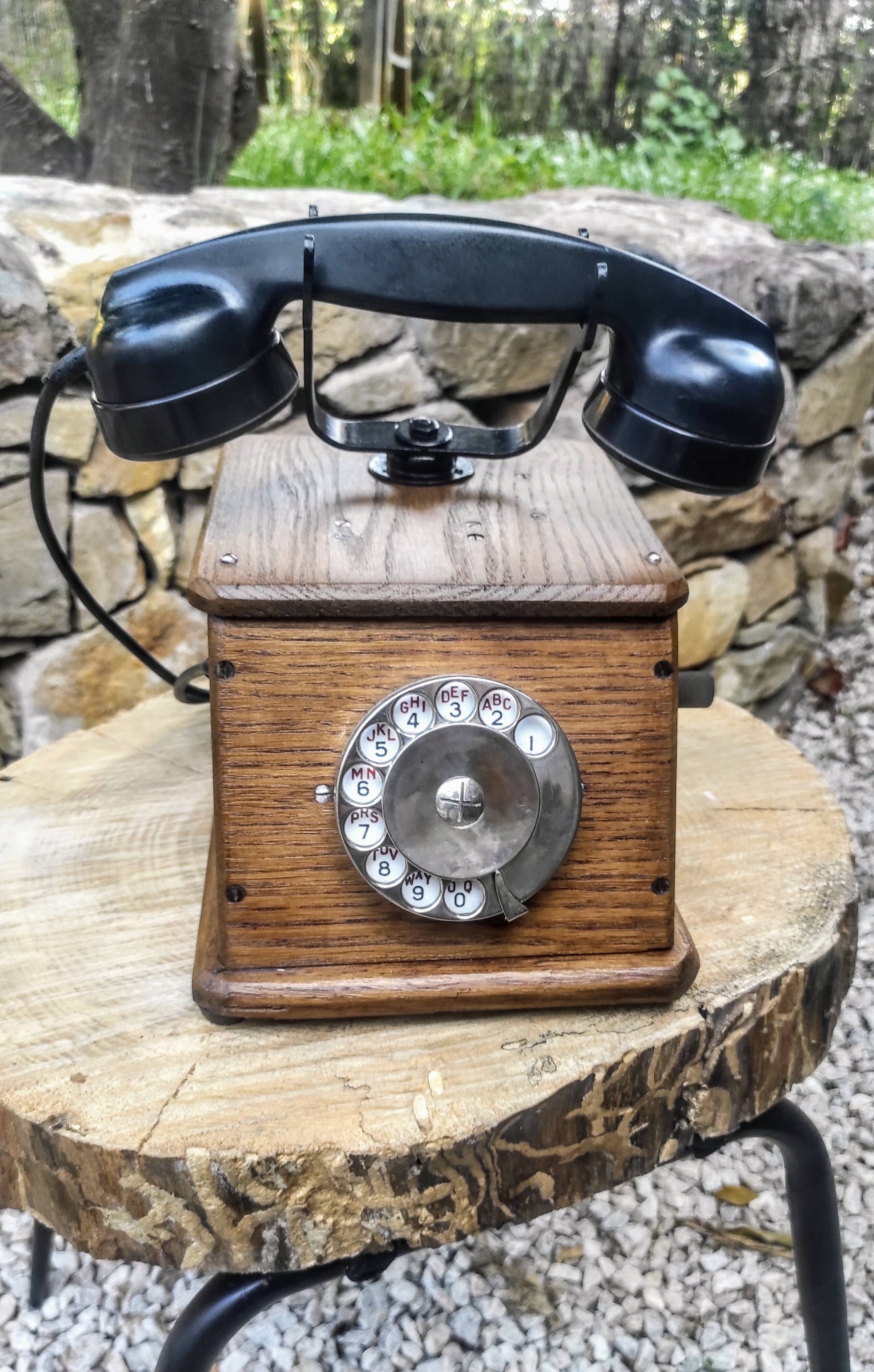 Old wooden dial crank telephone