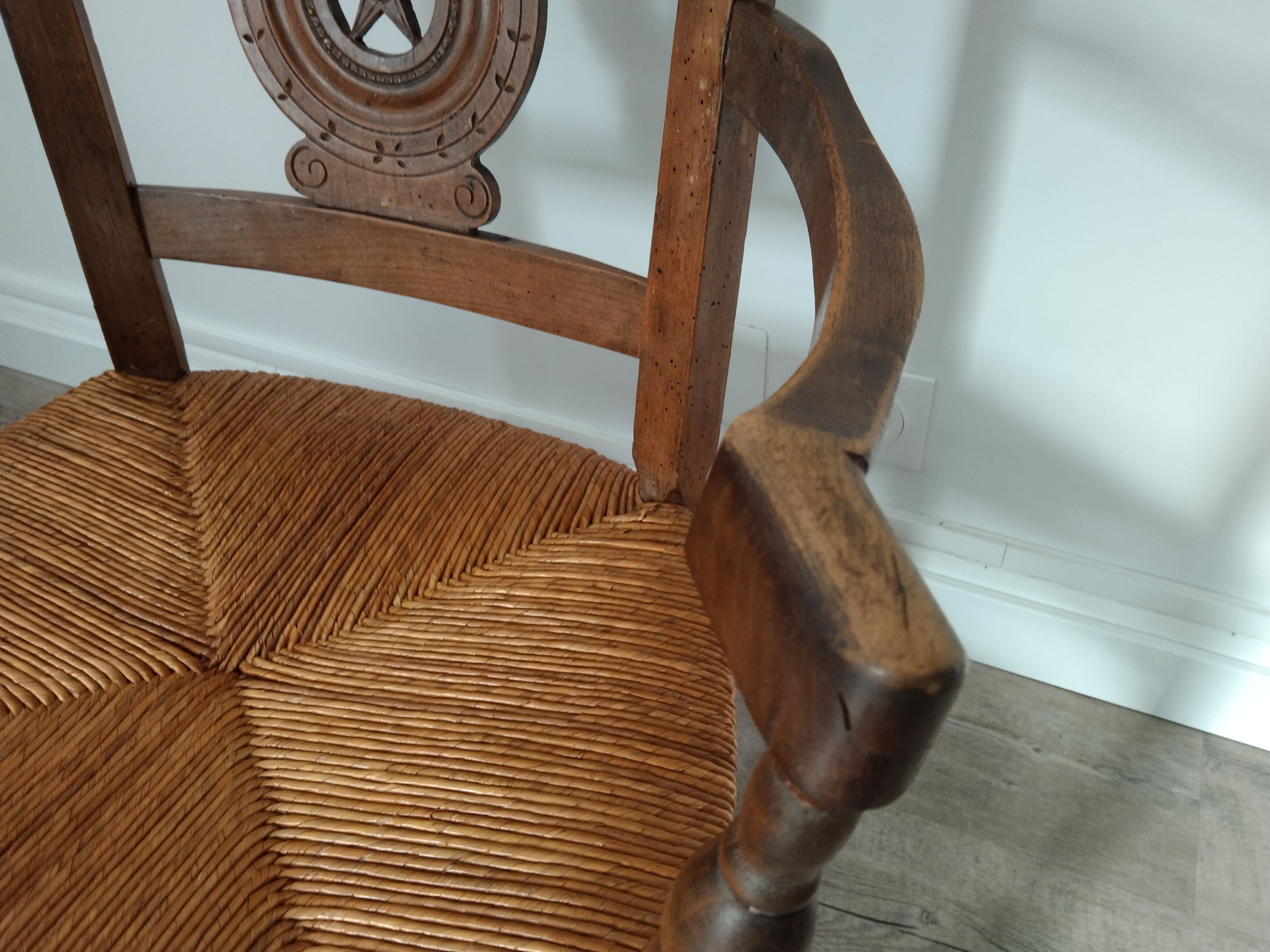Straw armchair folk art.