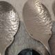6 individual silver-plated metal sauce spoons with hammered baguette handles