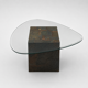 Unique design coffee table with natural stone base and organic glass top
