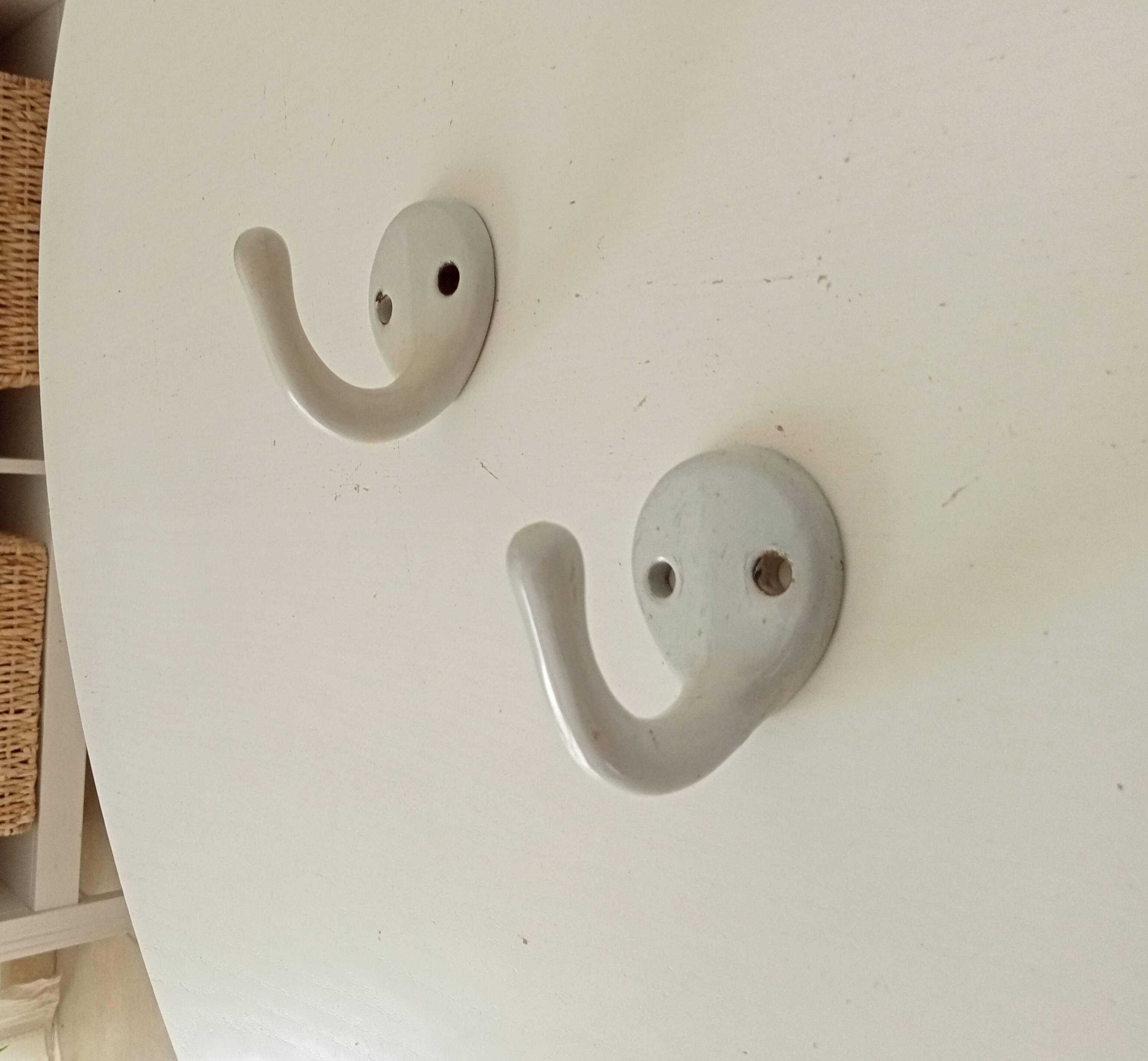 Antique enamelled cast iron wall hook from the 30s/40s