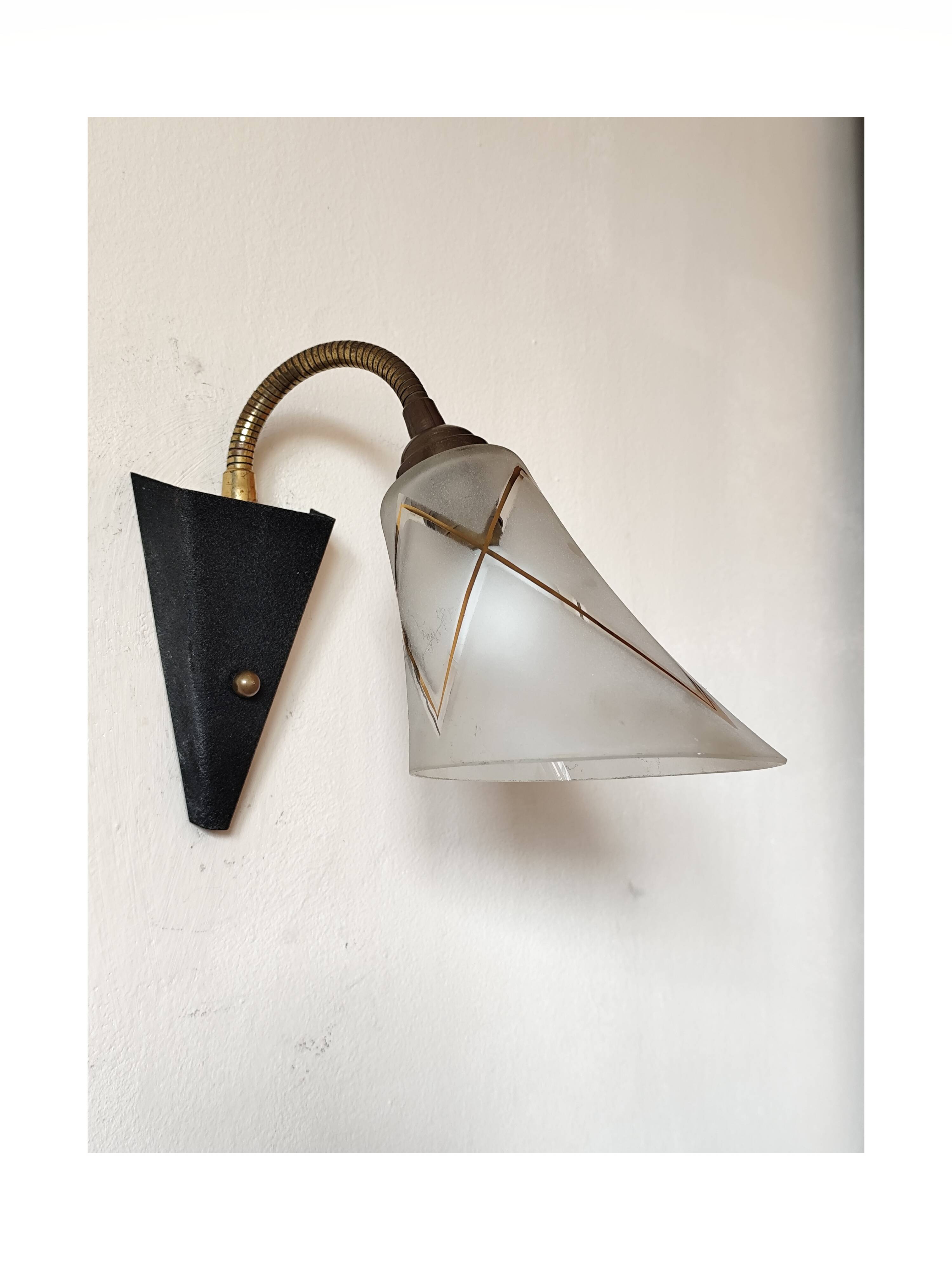 1950s wall lamp, metal, flexible brass stem and opaque shade.