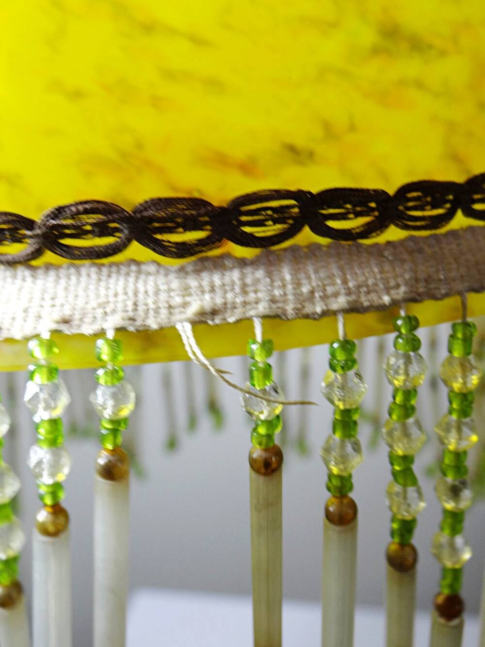 Antique Art Deco lampshade in yellow marbled glass with bead fringes.