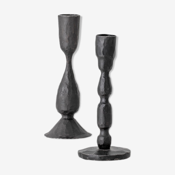 Black metal candlesticks poured out of iron