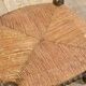 Low chair in beaded wood and straw