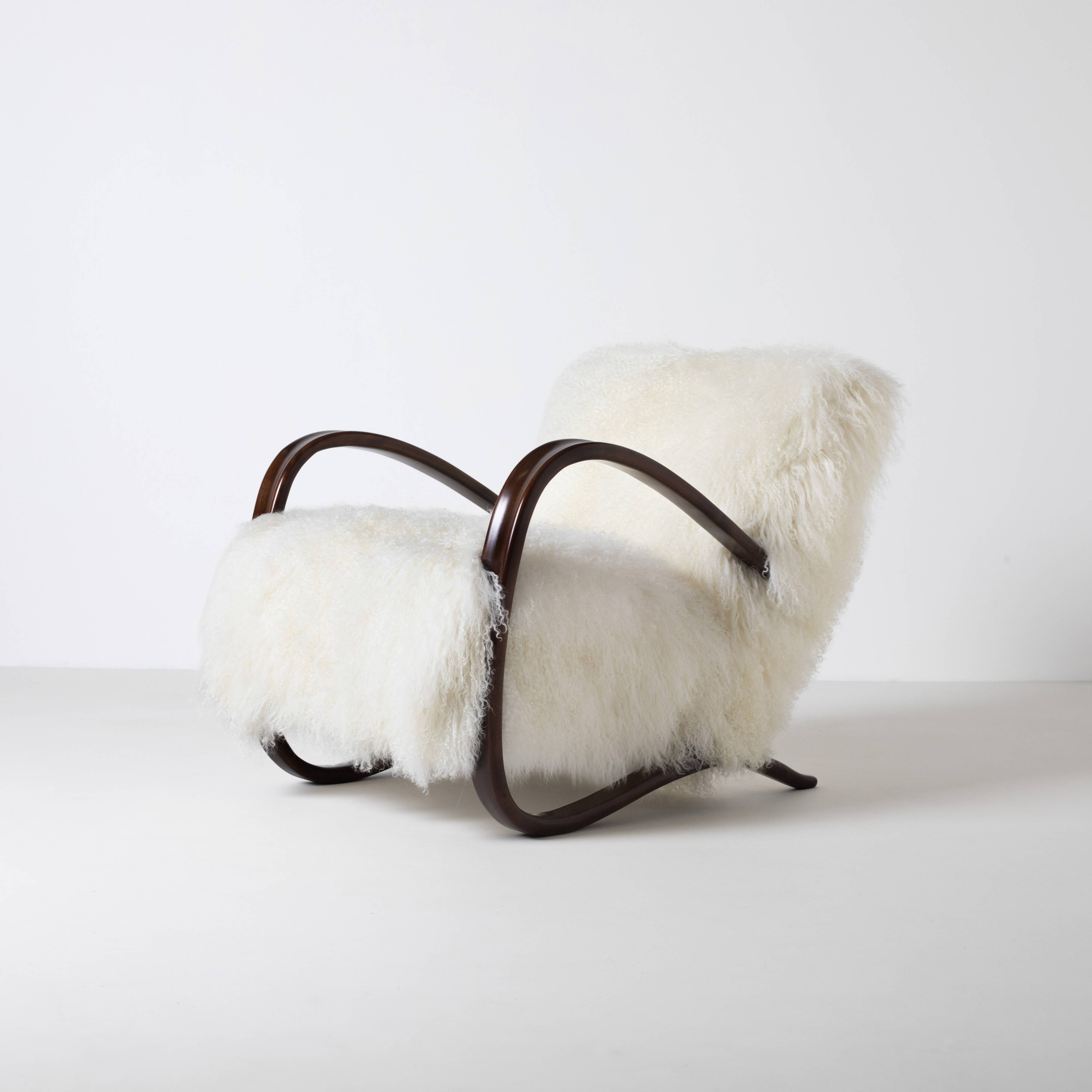 Pair of Jindrich Halabala H 269 lounge chairs in mongolian sheepskin