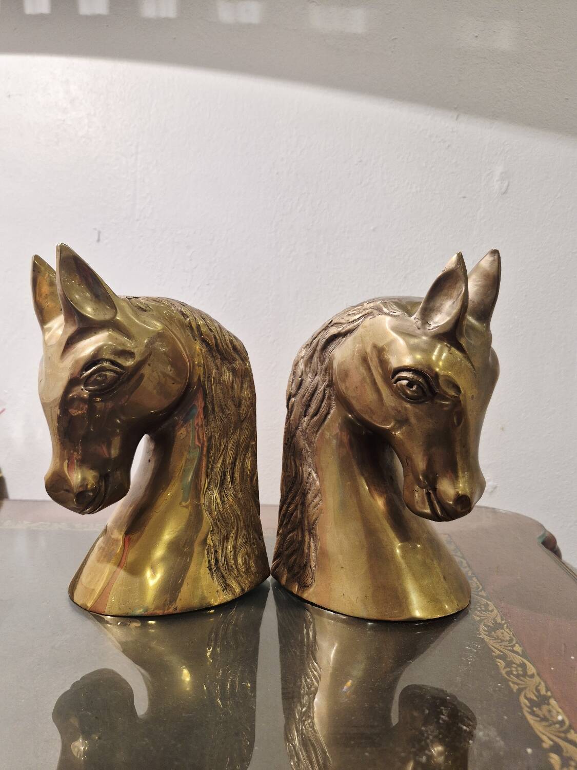 Serre livre têtes de cheval en laiton vintage