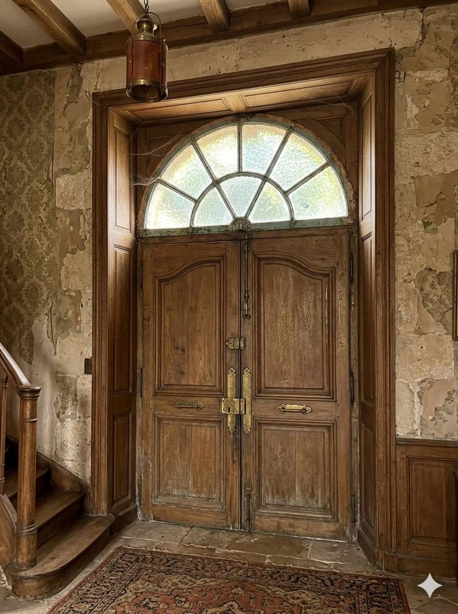 Old wrought iron full riveted gates from the 19th century.