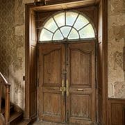 Old wrought iron full riveted gates from the 19th century.