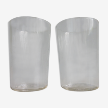 2 old-faceted glasses