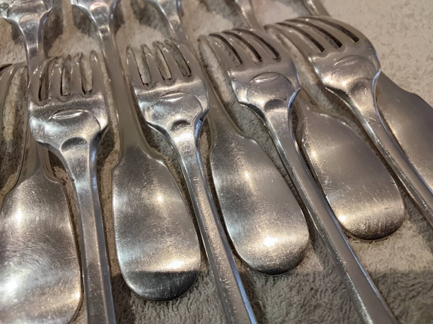 11 silver-plated table forks by Christofle Cluny with stripes
