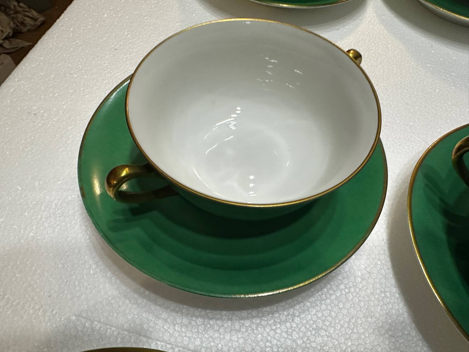 Service 14 cup and saucer in Art Deco Emerald Green and Gold.