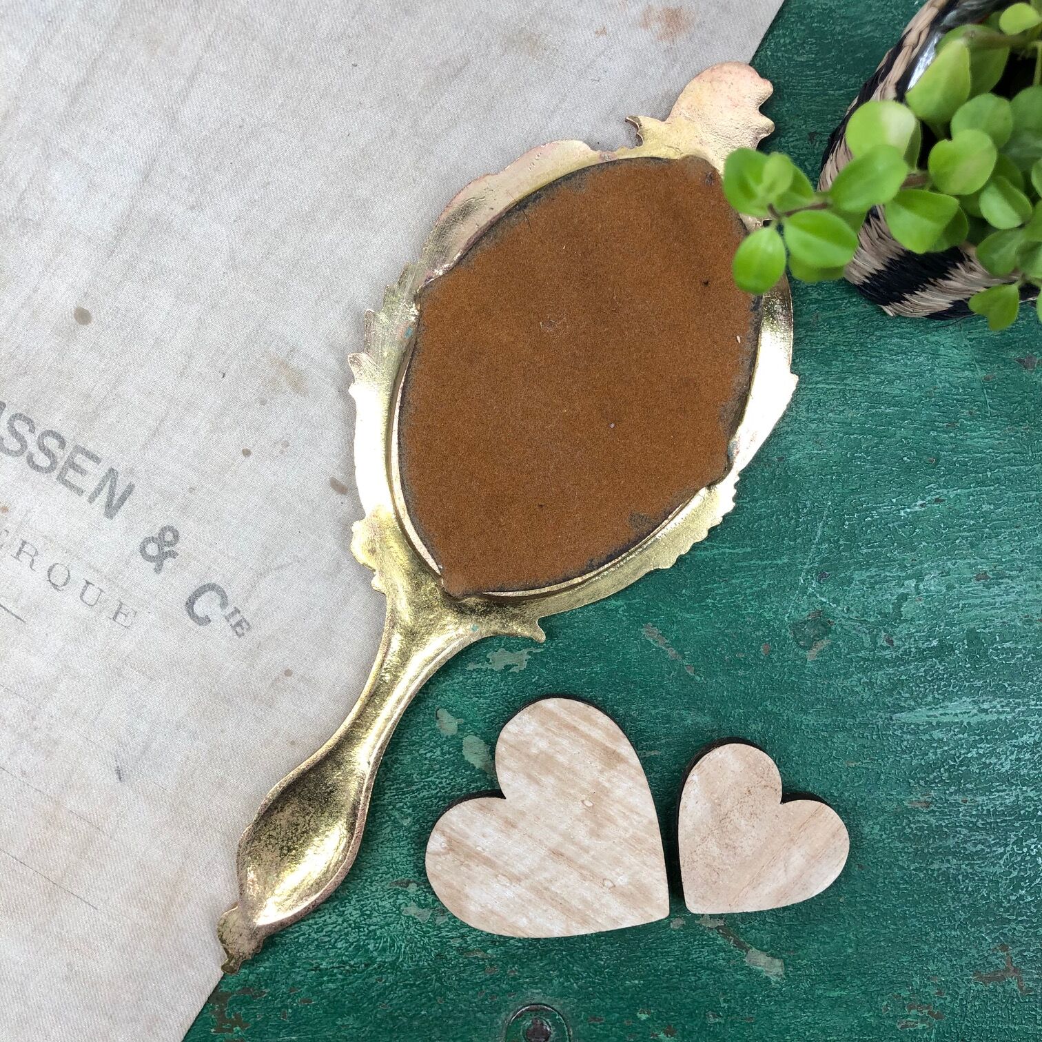 Bronze "face to hand" mirror