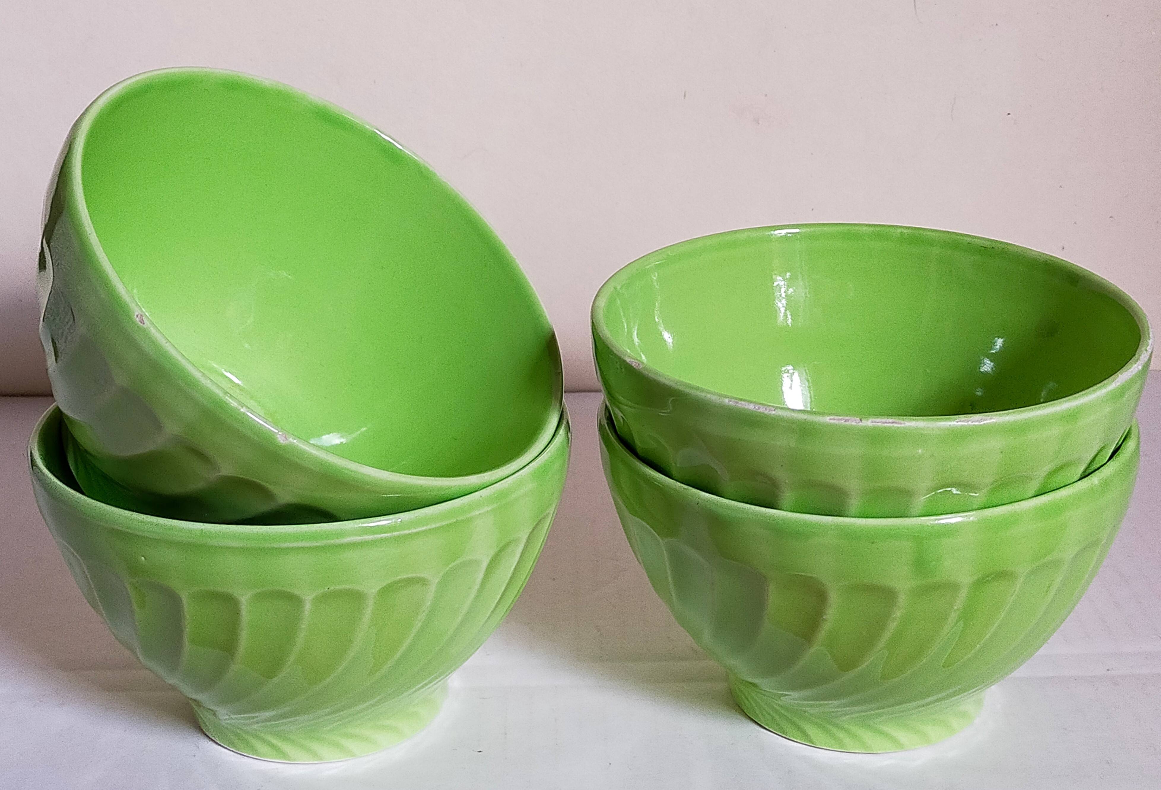 Four vintage spring green earthenware bowls