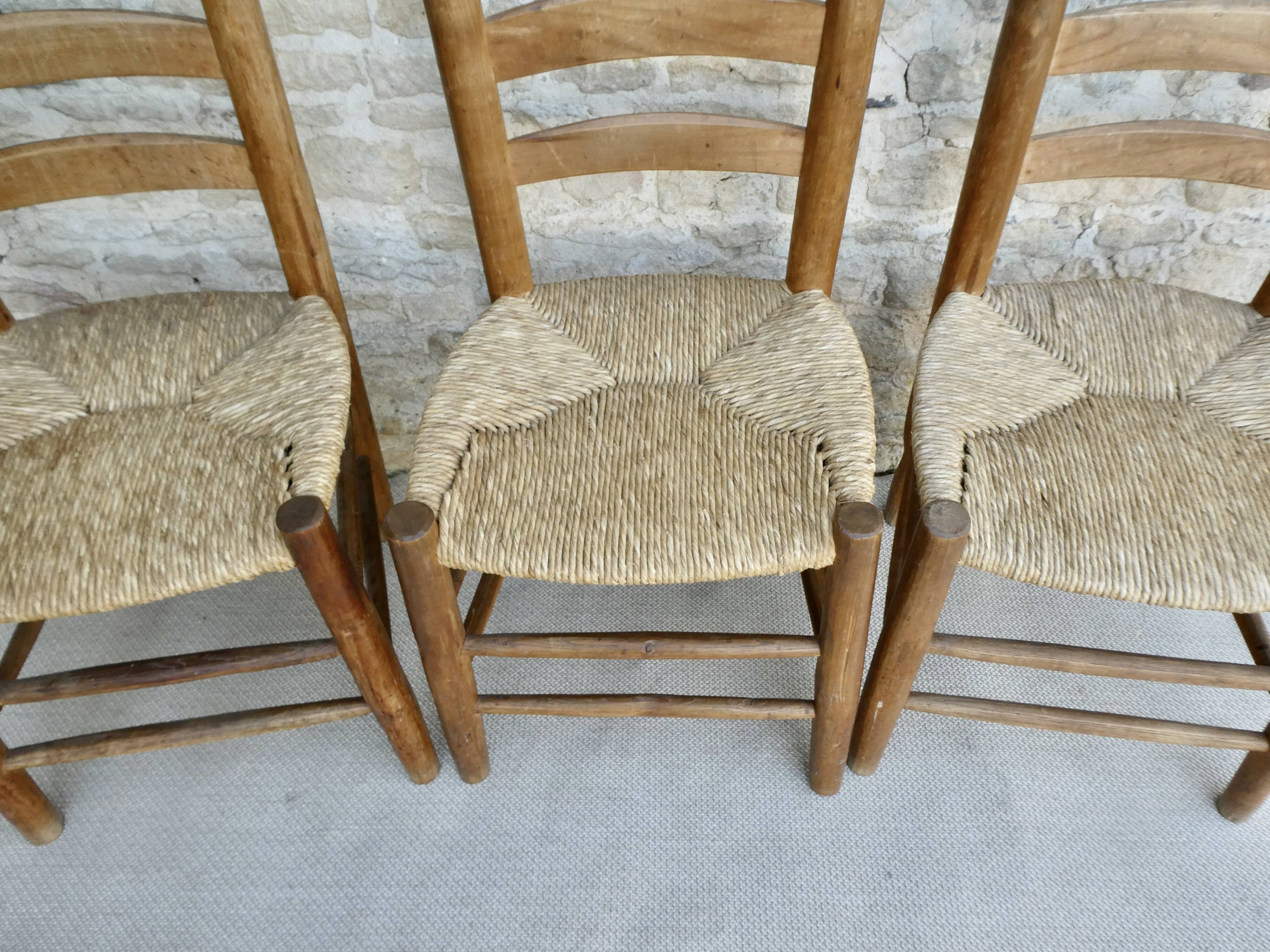 Trio of wooden chairs and mulched seat