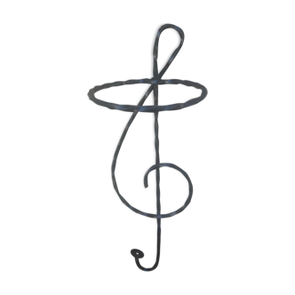 Former plant holder in the shape of a music note in twisted iron forged iron