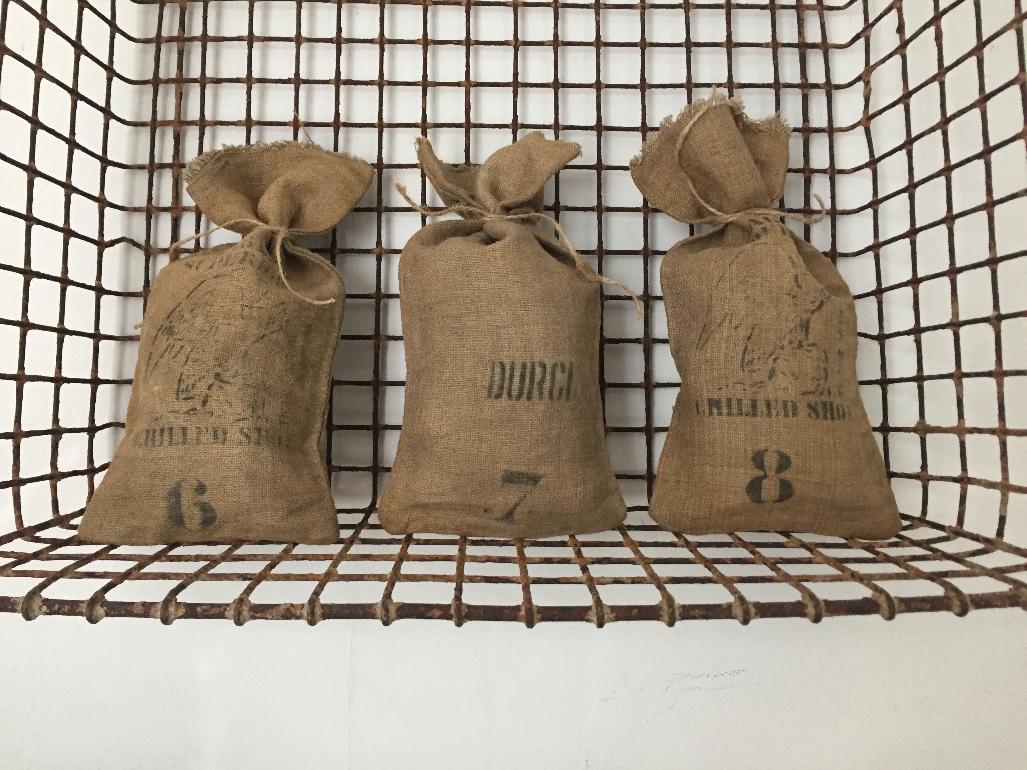 Set of three small jute bags, hardened lead