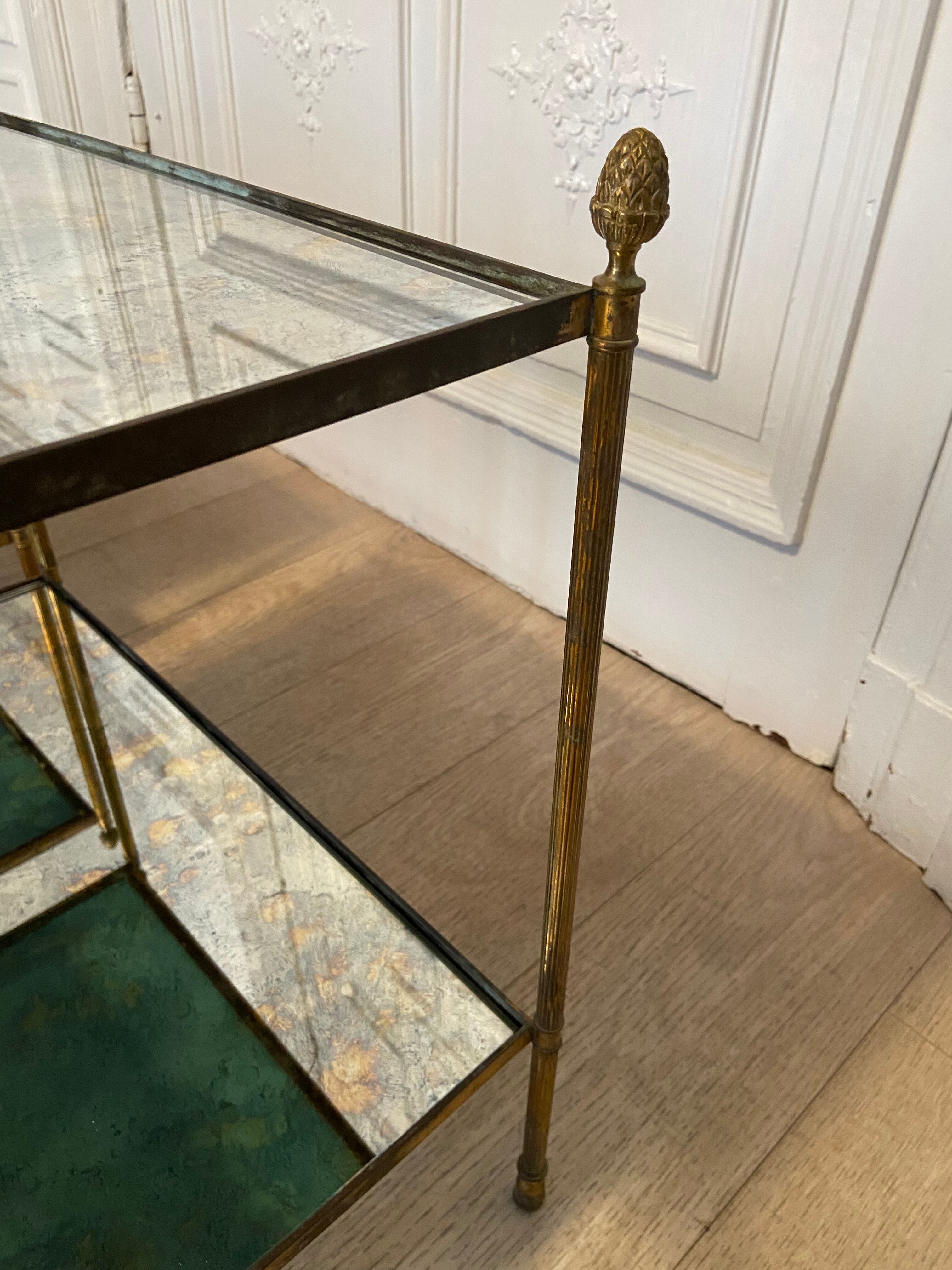 Pair of neo classic brass side tables and oxidized mirror