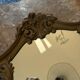 Antique mirror in Louis XV Rocaille style with carved frame.