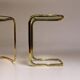 C. 1970 - Pair of side tables in gilded metal and smoked glass -