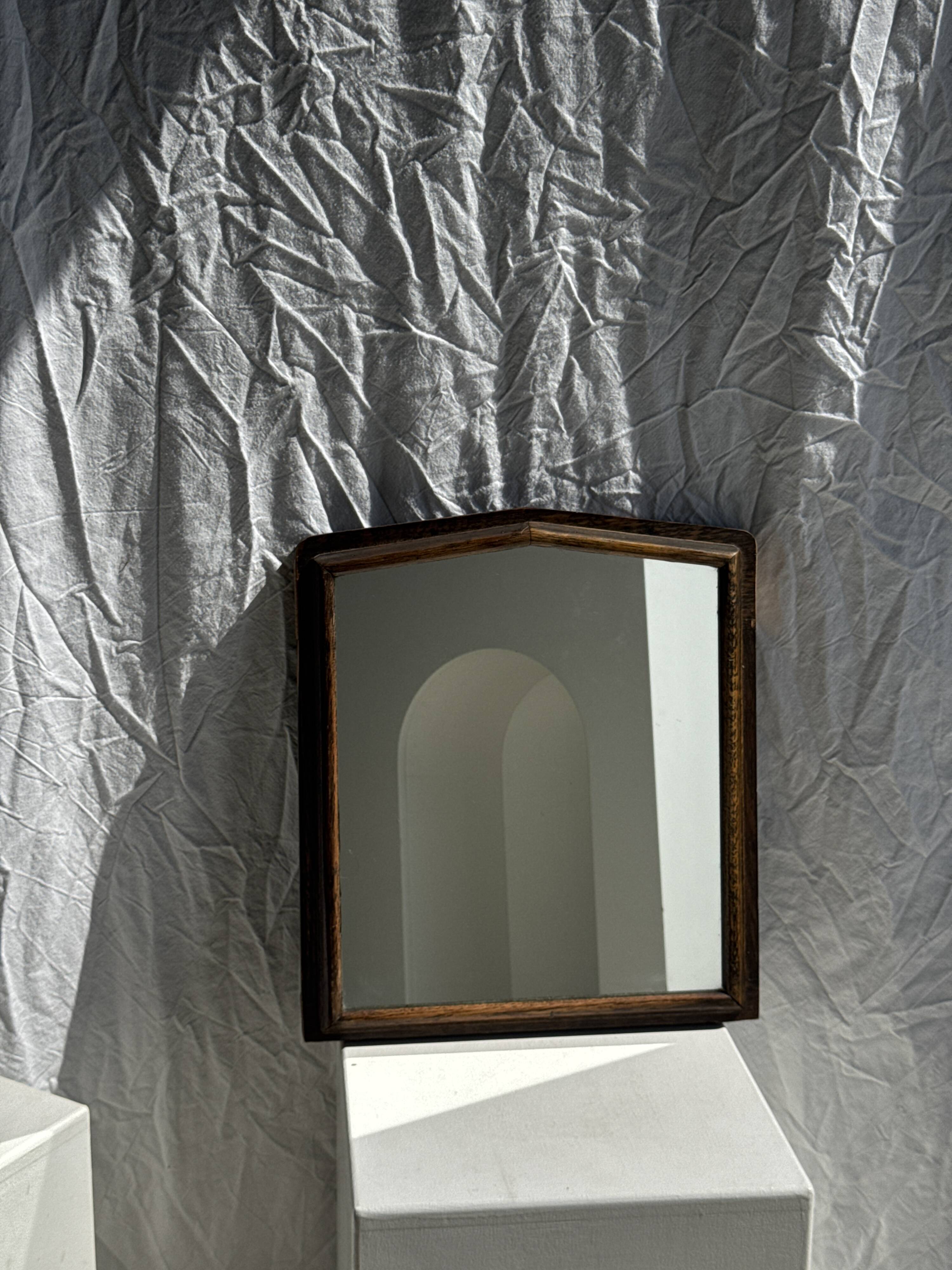 Small antique English rectangular mirror with pediment and oak frame